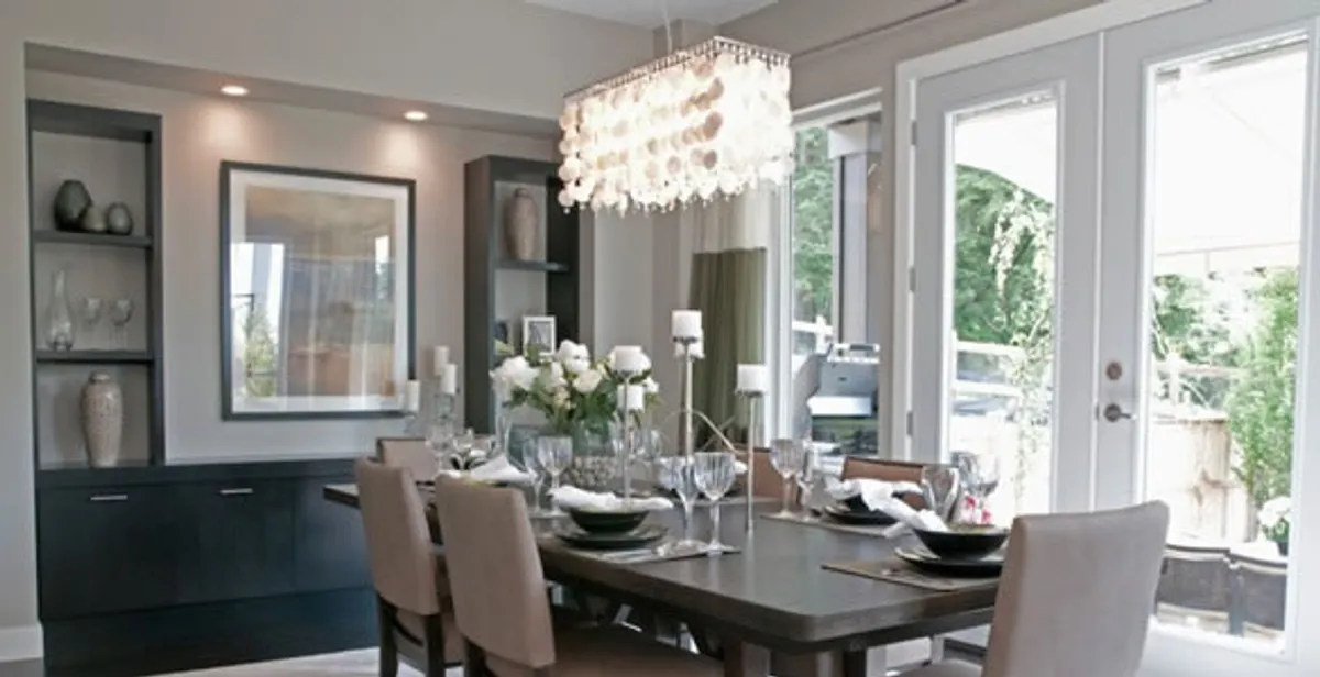 Elegant dining room chandelier installation above table in Salt Lake City, UT